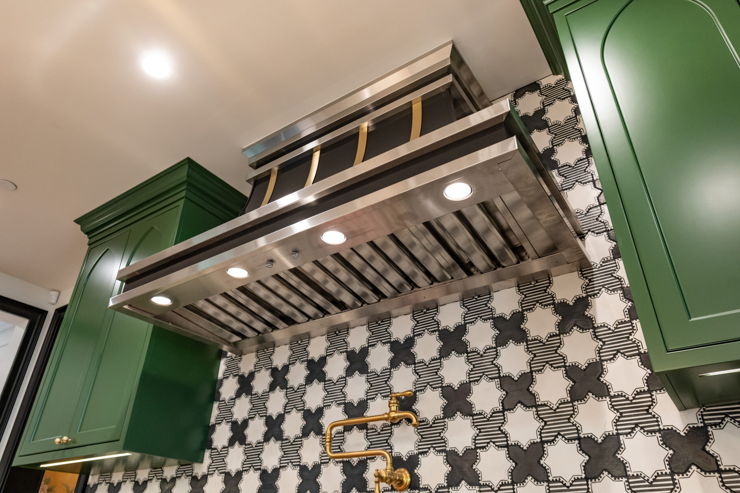 hidden range hood liner underside with accessible filters and lighting.