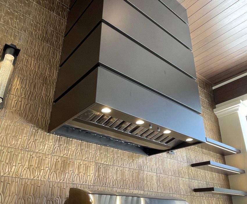 custom range hood blended into cabinetry in a custom kitchen.